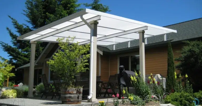 White acrylic patio cover shading a sunny backyard deck