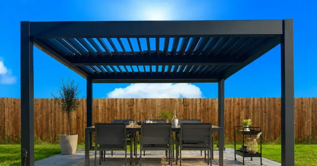 Motorized louvered pergola shading an outdoor dining area on a sunny backyard patio